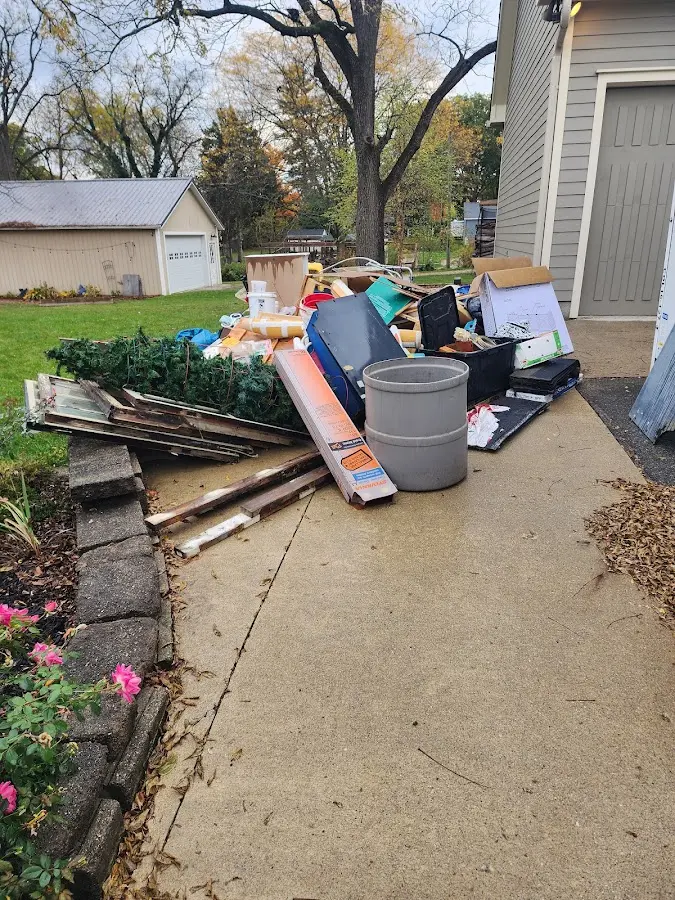 Dumpster being loaded with debris for Roofing Dumpster Rental in Cherry Grove